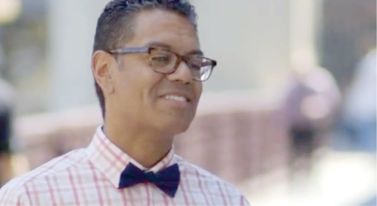 man in bowtie laughing