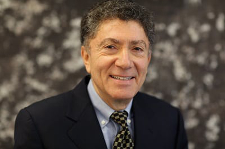 man with curly hair wearing a suit