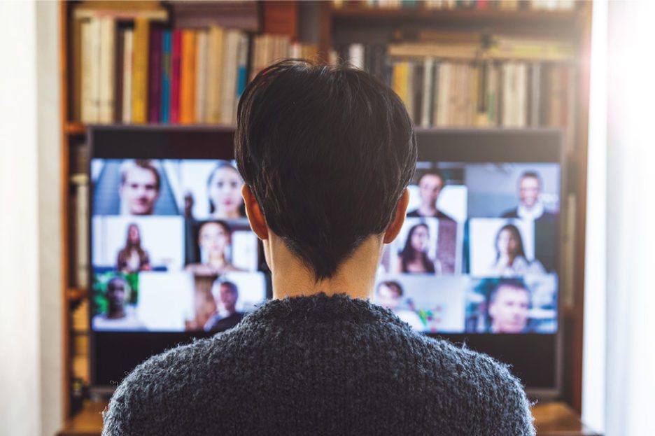 A professional setting showing a diverse group of individuals engaged in an online meeting through Microsoft Teams.