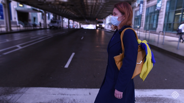 Picture of Hanna walking across the street.