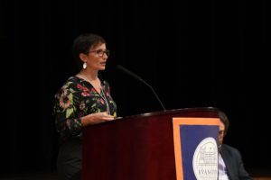 Dr. Kinzie at podium