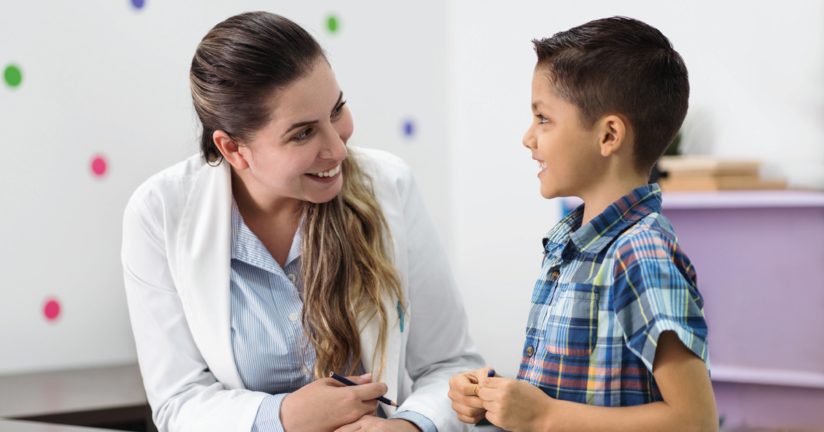 Image of a doctor working with a child.