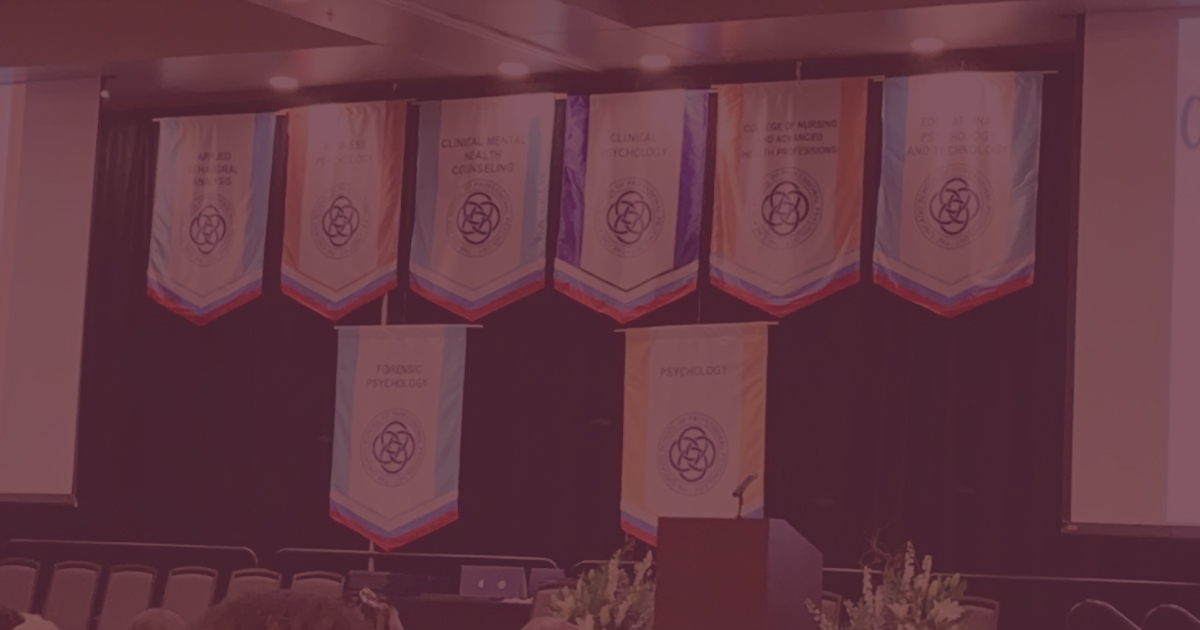 Photo of the commencement stage at The Chicago School's Dallas campus commencement.