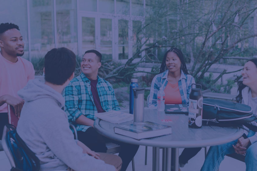 group of diverse people talking at a table