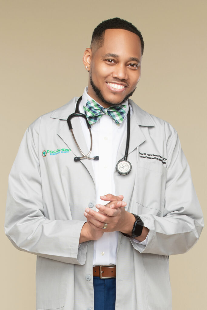 Dr. Brian Humphrey smiles in an official portrait photograph.