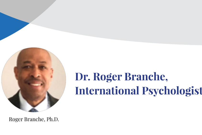Dr. Roger Branche smiles at the camera in a photograph inset on a banner displaying his name.