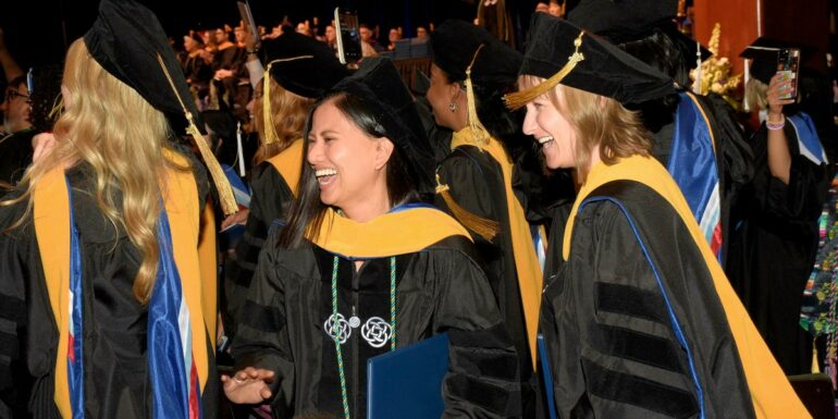 Newly minted graduates of The Chicago School celebrate at their spring 2024 commencement ceremony in Southern California.