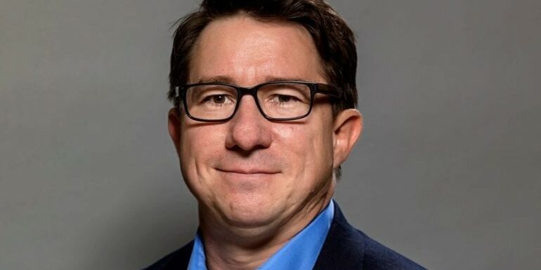 The Chicago School's Dr. Lance Garrison poses for a formal headshot.