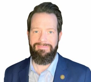 The CHicago School's Dr. Jonathan Dodrill smiles for the camera in an official headshot.