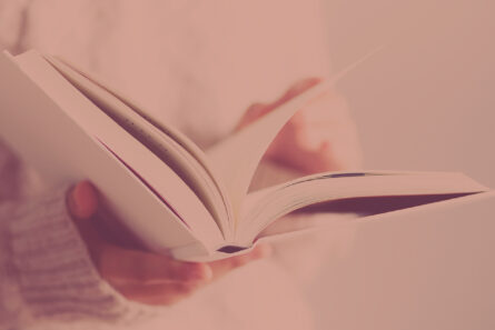 person holding a book with open pages