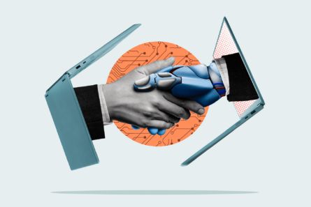 Two hands, one human and one robotic, each emerge from a laptop computer to shake each other.