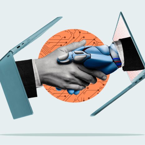 Two hands, one human and one robotic, each emerge from a laptop computer to shake each other.