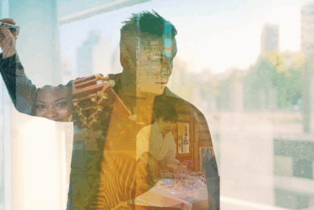 A silhouette of a teacher is overlaid on a background that shows global environments.