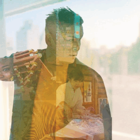 A silhouette of a teacher is overlaid on a background that shows global environments.