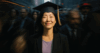 Photo of woman smiling and wearing a graduation cap.