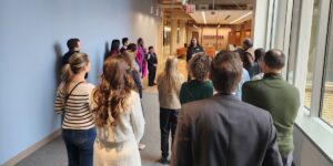 People attend a ceremony for The Chicago School's Chicago Campus.