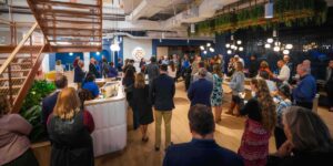 People attend a ceremony for The Chicago School's Washington, D.C, Campus.