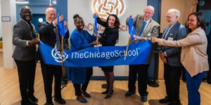 People attend a ceremony for The Chicago School's Washington, D.C, Campus.