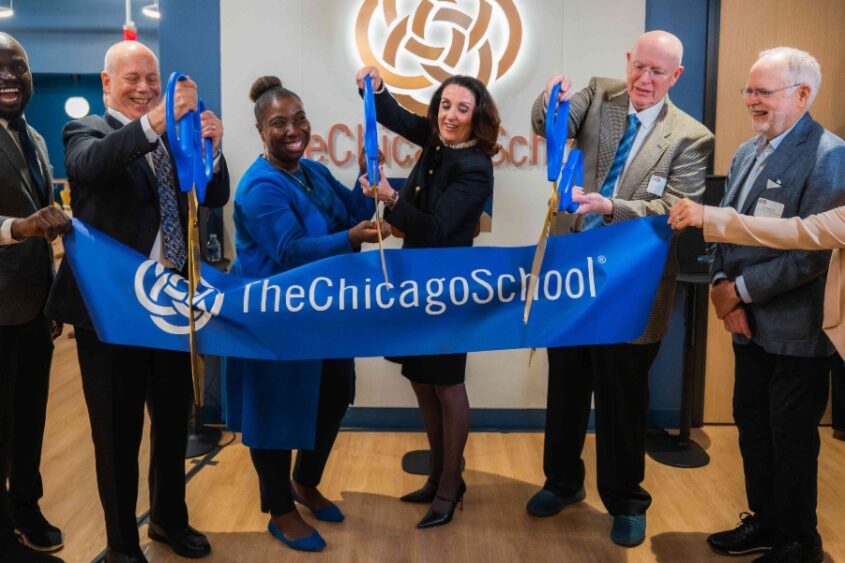 People attend a ceremony for The Chicago School's Washington, D.C, Campus.