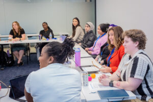 Adult students sitting in a classroom.