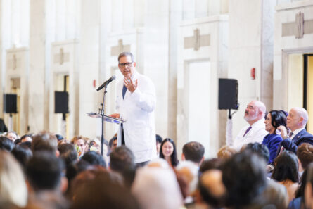 Dr. Jonathan Doris speaks from podium to audience.