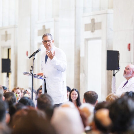 Dr. Jonathan Doris speaks from podium to audience.