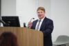 Dr. Kevin O'Connor speaking from podium.