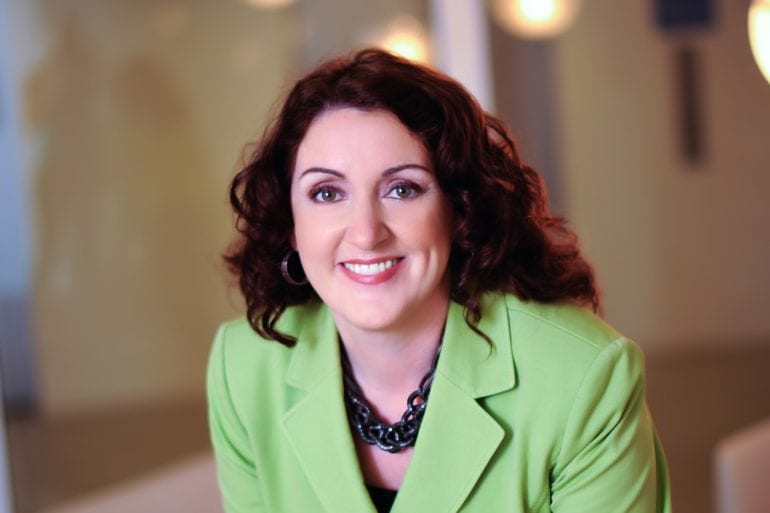 dr michele nealon in green business attire
