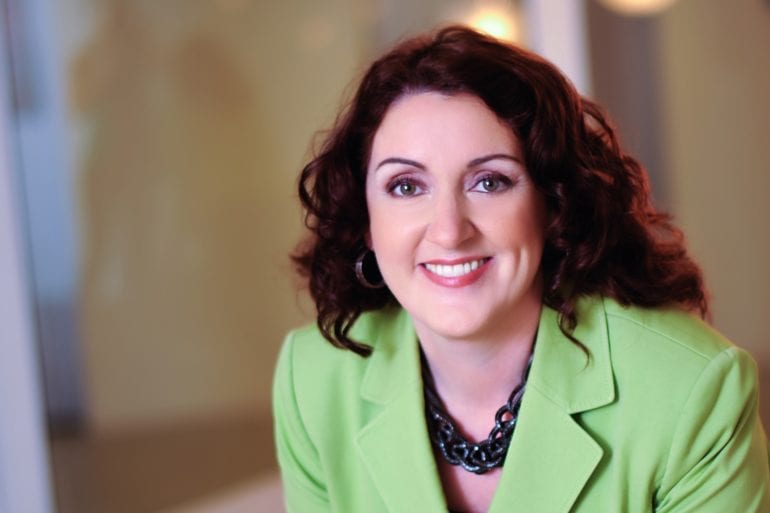 dr michele nealon in green business attire