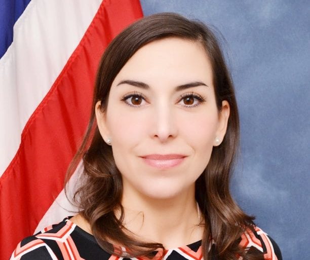 woman in front of american flag