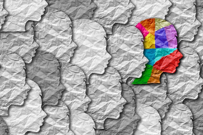 colored face in sea of gray