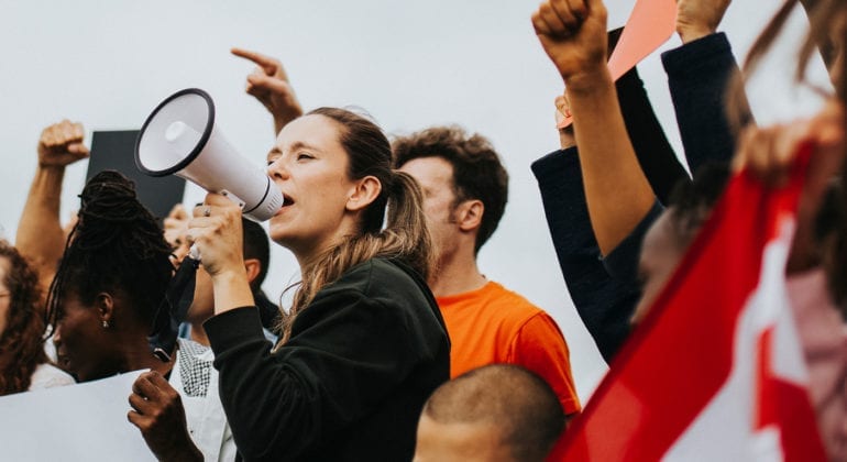 woman yelling with megaphone