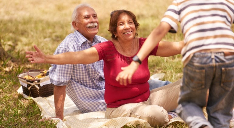 old couple on picnic blanket