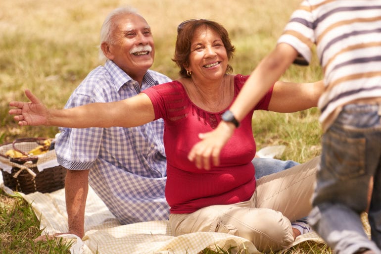 old couple on picnic blanket