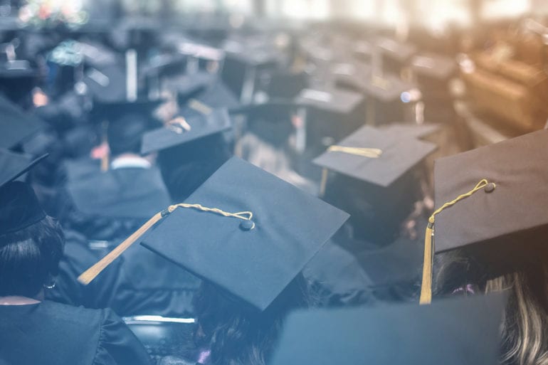 rear view of graduation caps