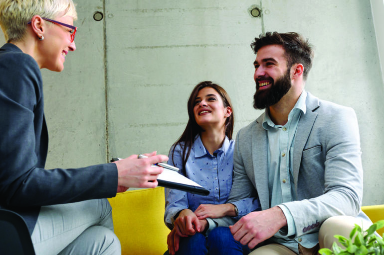 three people smiling