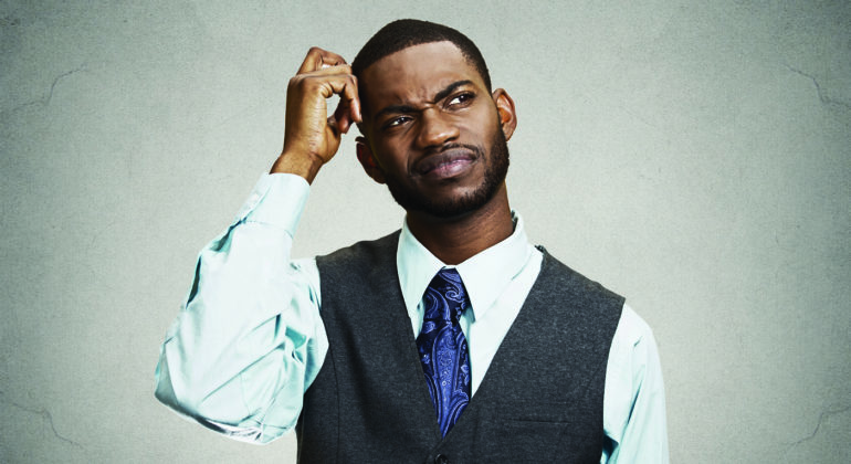 man scratching his head