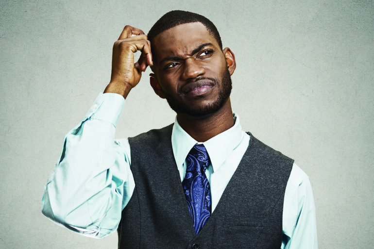 man scratching his head