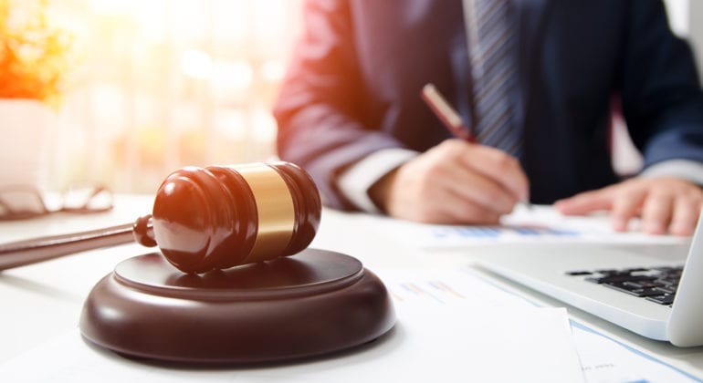 gavel next to laptop computer