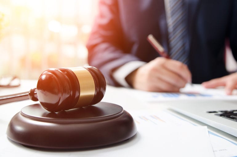 gavel next to laptop computer