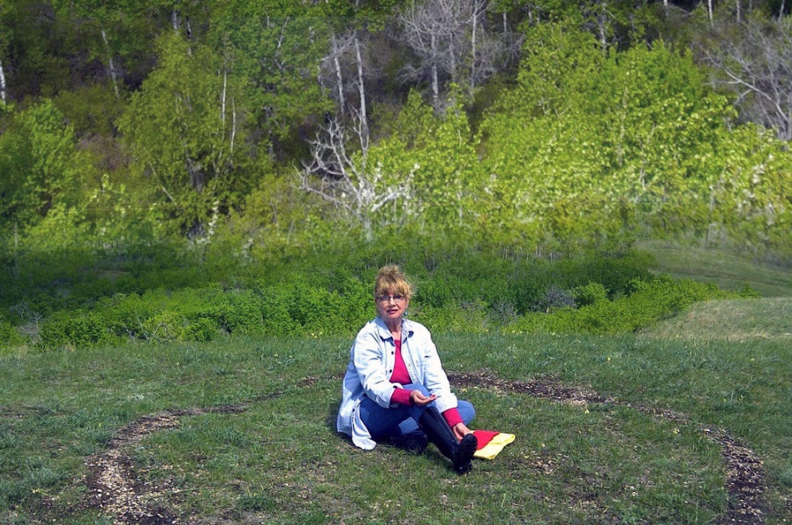 woman sitting in grass