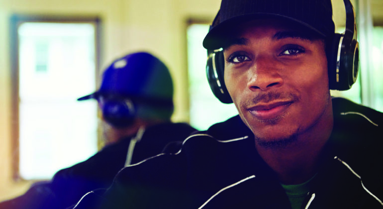 Rap and hip-hop therapy can help the mental health community, primarily ethnic minorities as featured in the image.