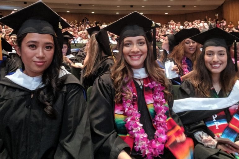 three women in caps and gowns