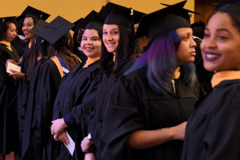 female students in graduation caps and gowns