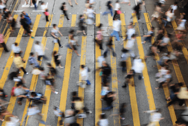 image of many people crossing a street