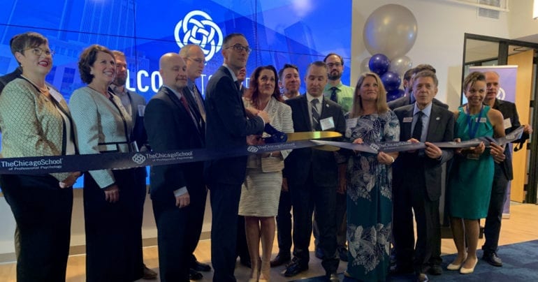 ribbon cutting ceremony with large scissors