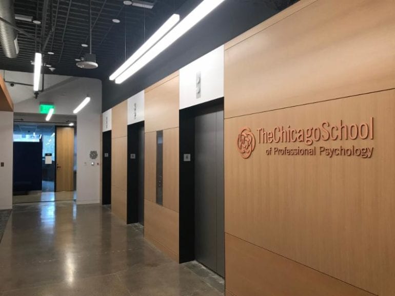 elevators next to the chicago school logo