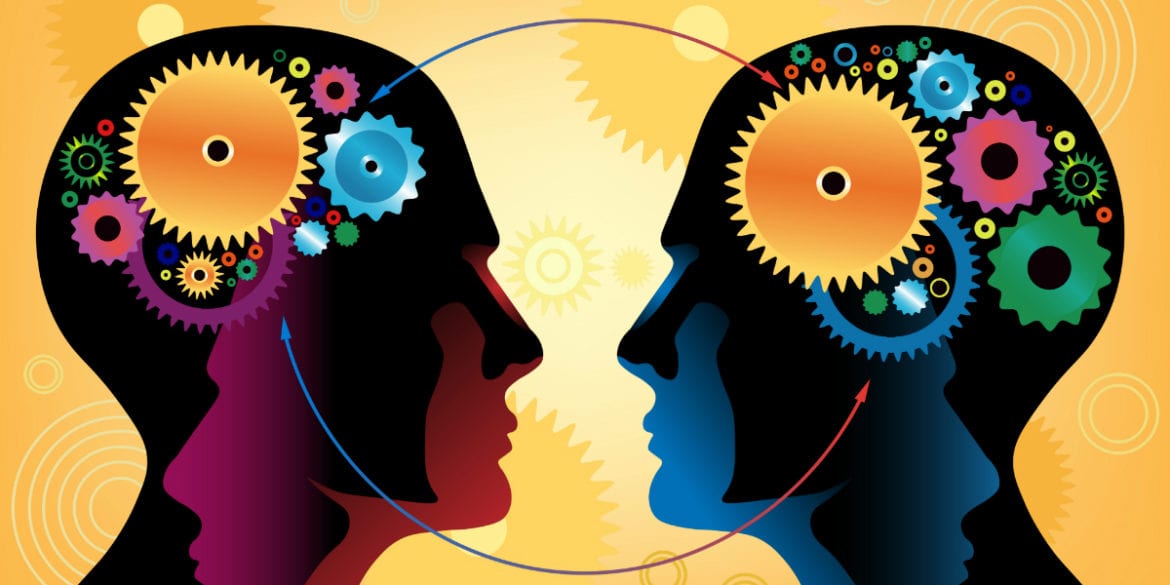 cartoon of two people with gears in their heads connecting