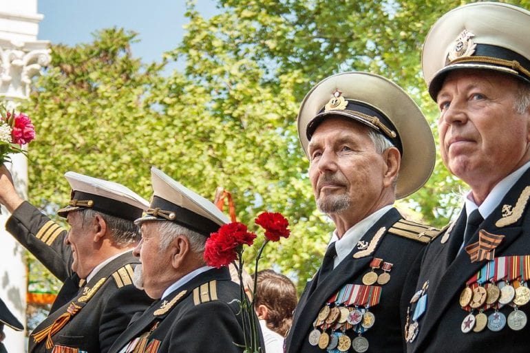 old men in military dress with medals