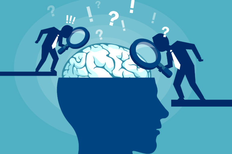 two detectives looking at a brain
